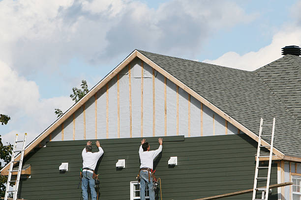 Professional Siding technician working in Hague, VA